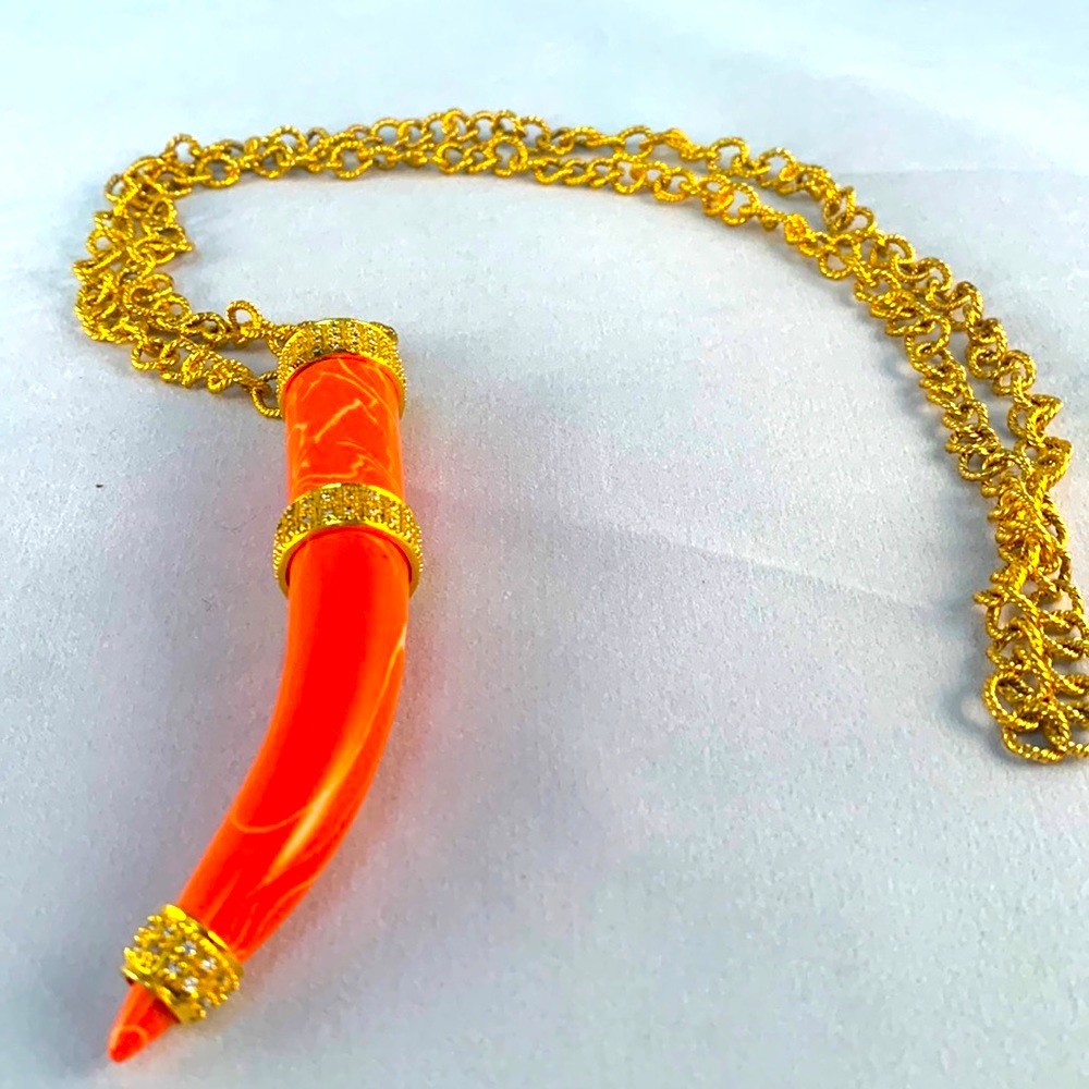 Orange tusk with gold plated necklace 20”